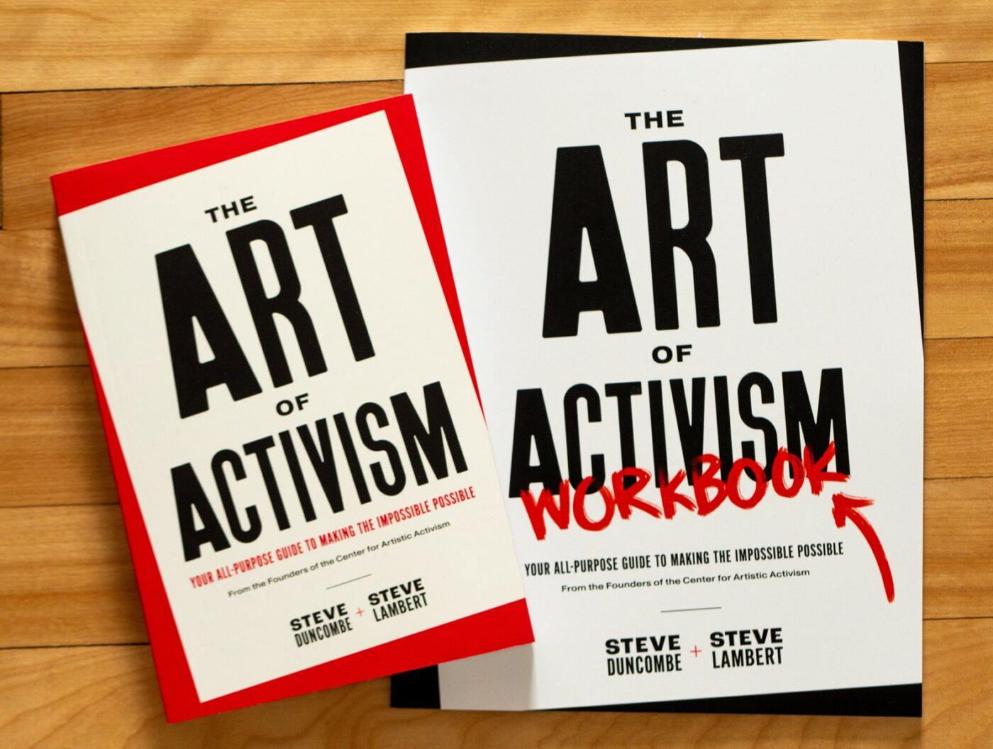 The Art of Activism book and workbook by Steve Duncombe and Steve Lambert on a wooden floor